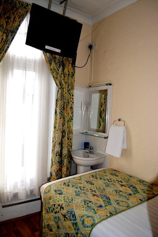 Falcon Hotel Londres Quarto foto
