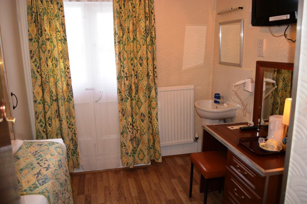 Falcon Hotel Londres Quarto foto